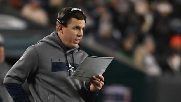 Jan 8, 2022; Philadelphia, Pennsylvania, USA; Dallas Cowboys offensive coordinator Kellen Moore stands on the sidelines against the Philadelphia Eagles during the second quarter at Lincoln Financial Field. Mandatory Credit: Tommy Gilligan-USA TODAY Sports